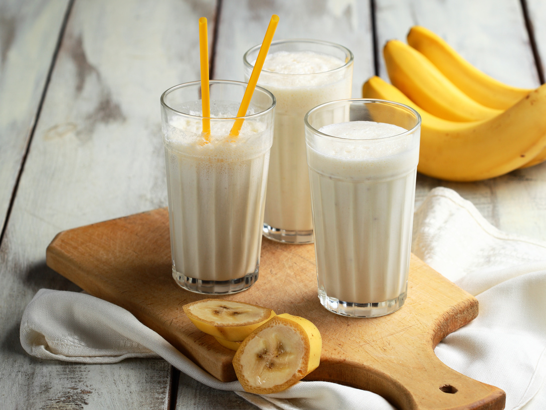 Banana milkshake. Three glasses of banana milkshake.